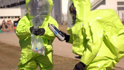workers in hazmat suits after chemical exposure