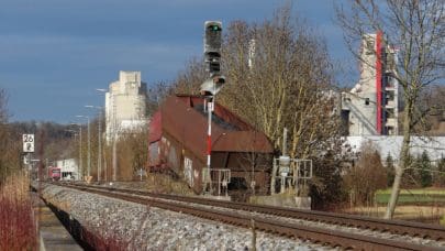 railway station with abandoned cargo cars on the side