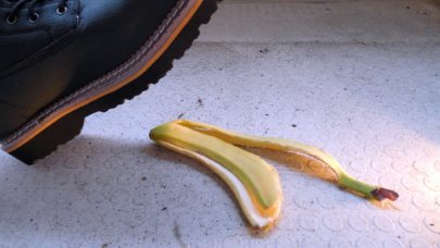 person at work about to injure their self after slipping on a banana peel