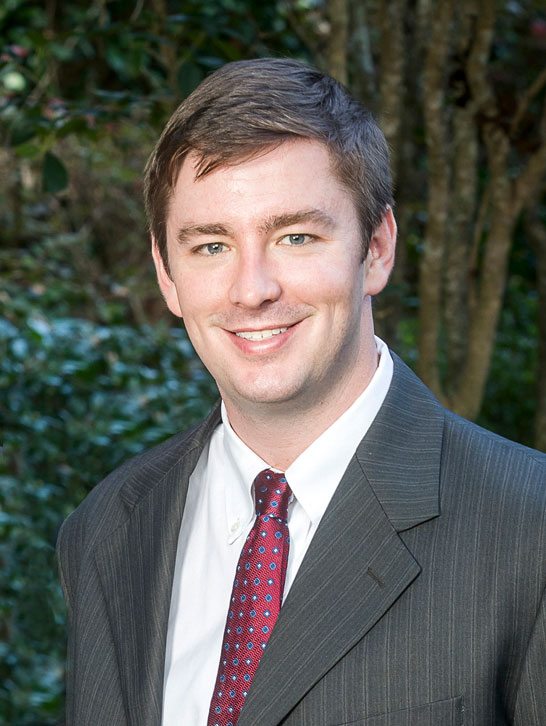 Portrait of Taylor Bassett, one of the personal attorneys at Morrow, Morrow, Ryan, Bassett and Haik