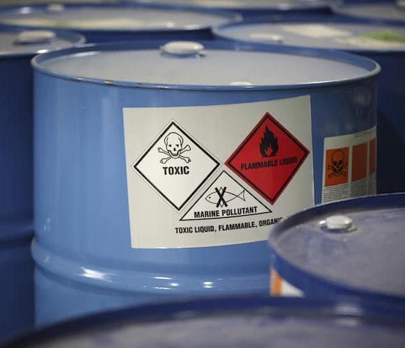 A chemical waste container with a toxic warning sticker.